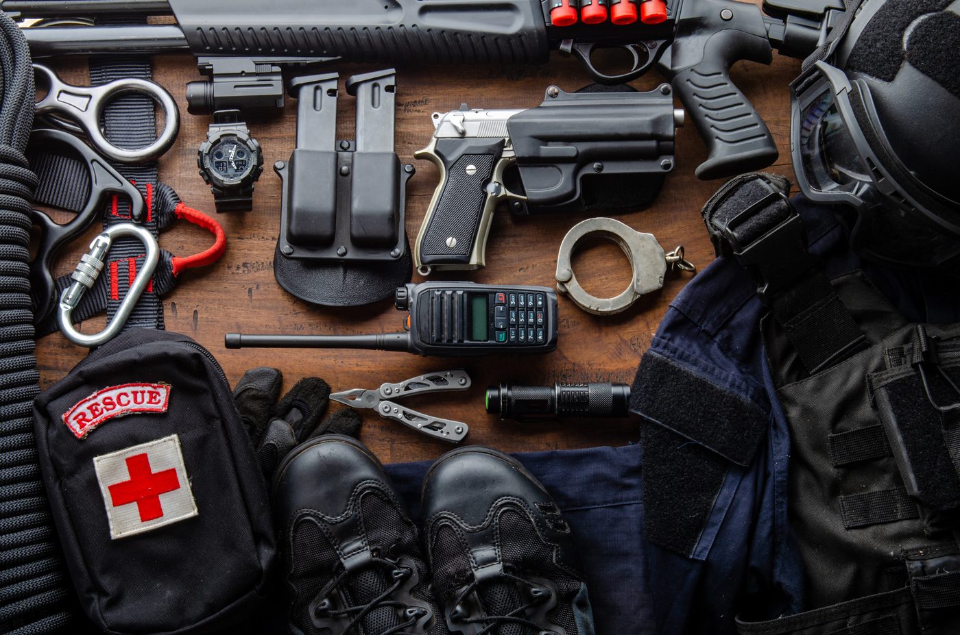 Tactical gear laid out on a workbench